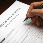 Former employee fills out unemployment benefits application for compensation.